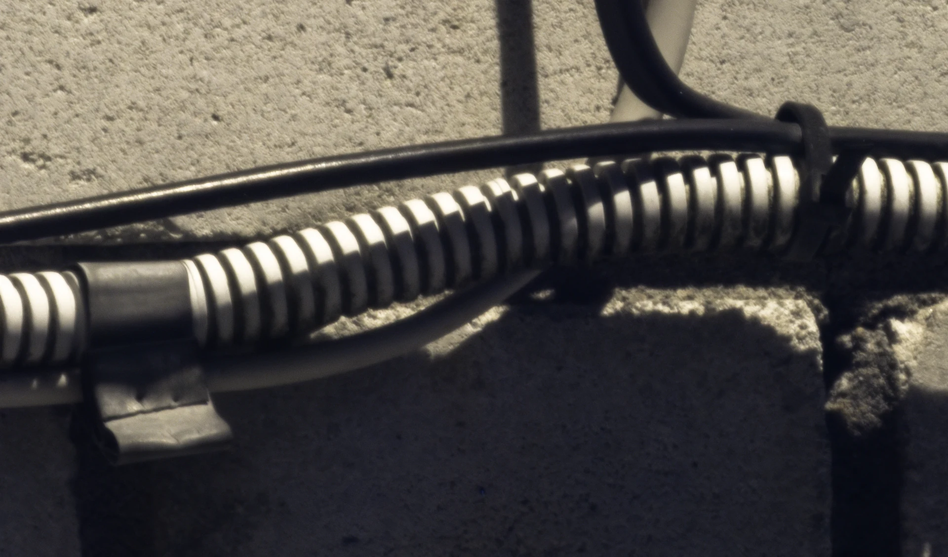 Facade cables photographed from 50 metres